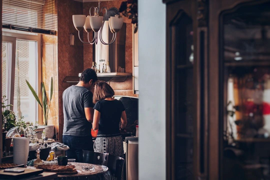 Couple standing in a kitchen